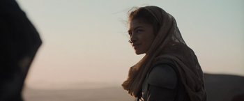 Movie still from “Dune” (2021), directed by Denis Villeneuve – A woman with a scarf around her head and face; Close Up shot, Over the shoulder angle