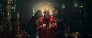 Movie still from “Dungeons & Dragons: Honor Among Thieves” (2023), directed by John Francis Daley – A group of men standing next to each other in a room; Medium shot, Low angle