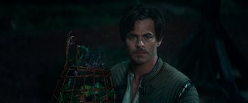 Movie still from “Dungeons & Dragons: Honor Among Thieves” (2023), directed by John Francis Daley – A person holding a basket of flowers; Close Up shot, Over the shoulder angle