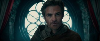 Movie still from “Dungeons & Dragons: Honor Among Thieves” (2023), directed by John Francis Daley – A person with a beard; Close Up shot, Low angle