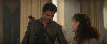 Movie still from “Dungeons & Dragons: Honor Among Thieves” (2023), directed by John Francis Daley – A man and a woman in medieval garb talking to each other; Medium shot, Over the shoulder angle