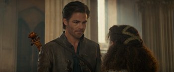 Movie still from “Dungeons & Dragons: Honor Among Thieves” (2023), directed by John Francis Daley – A person wearing a jacket; Close Up shot, Over the shoulder angle