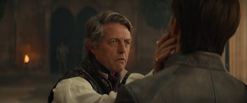 Movie still from “Dungeons & Dragons: Honor Among Thieves” (2023), directed by John Francis Daley – A person wearing a neck tie; Close Up shot, Over the shoulder angle