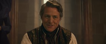 Movie still from “Dungeons & Dragons: Honor Among Thieves” (2023), directed by John Francis Daley – A person wearing a neck tie; Close Up shot, Over the shoulder angle