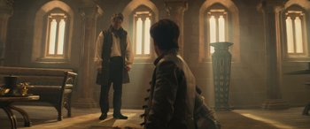 Movie still from “Dungeons & Dragons: Honor Among Thieves” (2023), directed by John Francis Daley – Two men in medieval garb in an old building; Wide shot, Over the shoulder angle