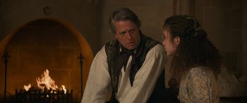 Movie still from “Dungeons & Dragons: Honor Among Thieves” (2023), directed by John Francis Daley – A man and a woman are standing next to each other; Medium shot, Over the shoulder angle