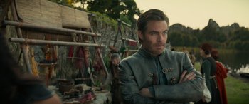 Movie still from “Dungeons & Dragons: Honor Among Thieves” (2023), directed by John Francis Daley – A man standing in front of a wall; Medium shot, Over the shoulder angle