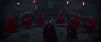 Movie still from “Dungeons & Dragons: Honor Among Thieves” (2023), directed by John Francis Daley – A group of people dressed in red robes and masks; Wide shot, High angle