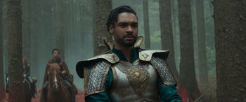 Movie still from “Dungeons & Dragons: Honor Among Thieves” (2023), directed by John Francis Daley – A man wearing a metal and leather armor; Close Up shot, Over the shoulder angle