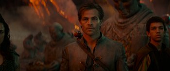Movie still from “Dungeons & Dragons: Honor Among Thieves” (2023), directed by John Francis Daley – A person wearing a robe; Medium shot, Low angle