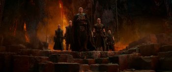 Movie still from “Dungeons & Dragons: Honor Among Thieves” (2023), directed by John Francis Daley – A group of men standing on top of rocks; Wide shot, High angle