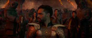 Movie still from “Dungeons & Dragons: Honor Among Thieves” (2023), directed by John Francis Daley – A man with a beard is wearing armor and standing in front of a group of people; Close Up shot, Over the shoulder angle