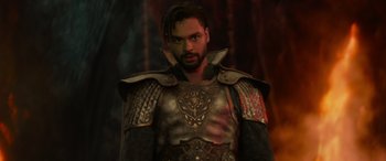 Movie still from “Dungeons & Dragons: Honor Among Thieves” (2023), directed by John Francis Daley – A man with a beard wearing armor and a helmet; Close Up shot, Over the shoulder angle