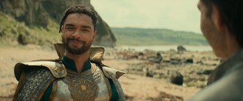 Movie still from “Dungeons & Dragons: Honor Among Thieves” (2023), directed by John Francis Daley – A person wearing a costume near a body of water; Close Up shot, Over the shoulder angle