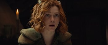 Movie still from “Dungeons & Dragons: Honor Among Thieves” (2023), directed by John Francis Daley – A person with curly hair; Close Up shot, Over the shoulder angle