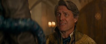 Movie still from “Dungeons & Dragons: Honor Among Thieves” (2023), directed by John Francis Daley – A person wearing a bow tie; Close Up shot, Over the shoulder angle