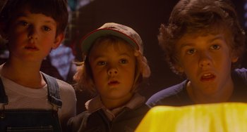 Movie still from “E.T. the Extra-Terrestrial” (1982), directed by Steven Spielberg – A group of children standing next to each other in a room; Close Up shot, Low angle
