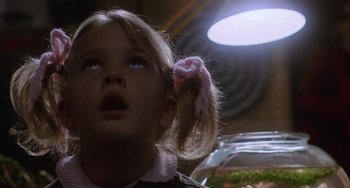 Movie still from “E.T. the Extra-Terrestrial” (1982), directed by Steven Spielberg – A little girl is looking up at the sky; Close Up shot, Low angle