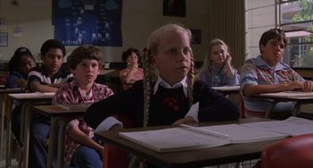 Movie still from “E.T. the Extra-Terrestrial” (1982), directed by Steven Spielberg – A group of children sitting at a desk in a classroom; Medium shot, High angle