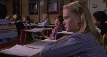 Movie still from “E.T. the Extra-Terrestrial” (1982), directed by Steven Spielberg – A group of young people sitting at a table; Medium shot, Over the shoulder angle