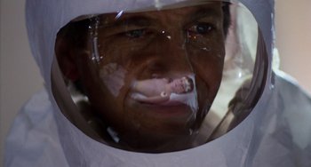 Movie still from “E.T. the Extra-Terrestrial” (1982), directed by Steven Spielberg – A person wearing a face shield; Close Up shot, Low angle