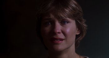 Movie still from “E.T. the Extra-Terrestrial” (1982), directed by Steven Spielberg – A person with a crying face; Close Up shot, Over the shoulder angle