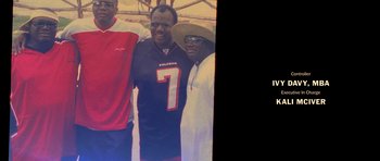 Movie still from “Chappelle's Home Team - Earthquake: Legendary” (2022), directed by Stan Lathan – A group of men standing next to each other; Medium shot, High angle