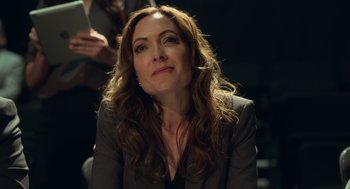 Movie still from “Easter Sunday” (2022), directed by Jay Chandrasekhar – A person wearing a suit and tie; Close Up shot, Over the shoulder angle