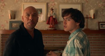 Movie still from “Easter Sunday” (2022), directed by Jay Chandrasekhar – Two men standing next to each other in a room; Medium shot, Over the shoulder angle