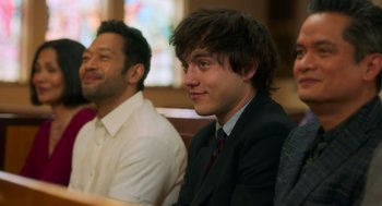 Movie still from “Easter Sunday” (2022), directed by Jay Chandrasekhar – A man in a suit sitting next to another man in a suit; Close Up shot, Over the shoulder angle