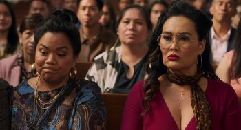 Movie still from “Easter Sunday” (2022), directed by Jay Chandrasekhar – A group of people sitting in a room; Close Up shot, Over the shoulder angle