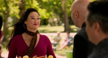 Movie still from “Easter Sunday” (2022), directed by Jay Chandrasekhar – A woman in a red shirt is talking to a man; Medium shot, Over the shoulder angle