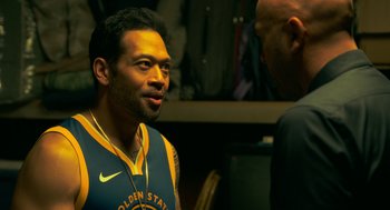 Movie still from “Easter Sunday” (2022), directed by Jay Chandrasekhar – A man in a blue and yellow shirt talking to another man in a black shirt; Close Up shot, Over the shoulder angle