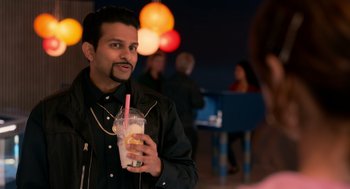 Movie still from “Easter Sunday” (2022), directed by Jay Chandrasekhar – A man holding a drink in his hand; Close Up shot, Over the shoulder angle
