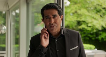 Movie still from “Easter Sunday” (2022), directed by Jay Chandrasekhar – A person talking on a cell phone; Close Up shot, Low angle