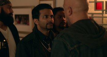 Movie still from “Easter Sunday” (2022), directed by Jay Chandrasekhar – A man with a beard is looking at another man; Close Up shot, Over the shoulder angle
