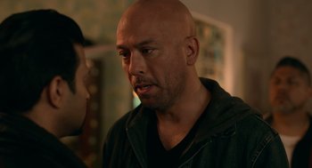 Movie still from “Easter Sunday” (2022), directed by Jay Chandrasekhar – A man with a bald head talking to another man; Close Up shot, Over the shoulder angle