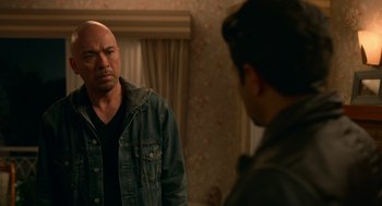 Movie still from “Easter Sunday” (2022), directed by Jay Chandrasekhar – A man standing in front of a mirror looking at himself in the mirror; Medium shot, Over the shoulder angle