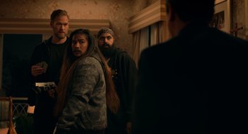 Movie still from “Easter Sunday” (2022), directed by Jay Chandrasekhar – A group of people standing next to each other in a room; Medium shot, Over the shoulder angle