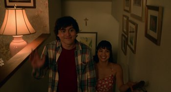 Movie still from “Easter Sunday” (2022), directed by Jay Chandrasekhar – A man and a woman standing next to each other; Medium shot, Low angle