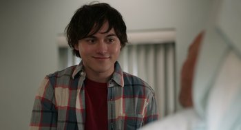 Movie still from “Easter Sunday” (2022), directed by Jay Chandrasekhar – A young man is smiling in front of a mirror; Close Up shot, Over the shoulder angle