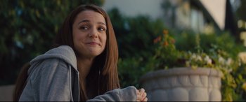 Movie still from “A Dog's Journey” (2019), directed by Gail Mancuso – A woman with long brown hair and a gray hoodie; Medium shot, Over the shoulder angle