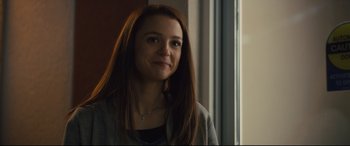 Movie still from “A Dog's Journey” (2019), directed by Gail Mancuso – A woman with long brown hair standing in front of a window; Close Up shot, Over the shoulder angle