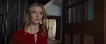 Movie still from “A Dog's Journey” (2019), directed by Gail Mancuso – A woman in a red shirt is standing in front of a door; Close Up shot, Over the shoulder angle