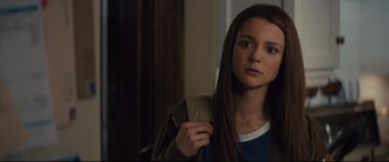 Movie still from “A Dog's Journey” (2019), directed by Gail Mancuso – A woman with long hair is holding a bag; Close Up shot, Over the shoulder angle