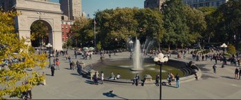 Movie still from “A Dog's Journey” (2019), directed by Gail Mancuso – A group of people gathered around a fountain; Extreme Wide shot, High angle