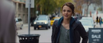 Movie still from “A Dog's Journey” (2019), directed by Gail Mancuso – A woman standing on the side of the street; Close Up shot, Over the shoulder angle