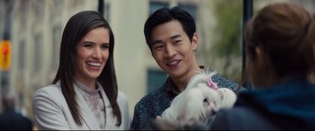 Movie still from “A Dog's Journey” (2019), directed by Gail Mancuso – A man and a woman holding a small white dog; Close Up shot, Over the shoulder angle