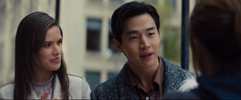 Movie still from “A Dog's Journey” (2019), directed by Gail Mancuso – A young asian man in a jacket looking at the camera; Close Up shot, Over the shoulder angle