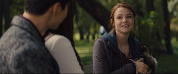 Movie still from “A Dog's Journey” (2019), directed by Gail Mancuso – A woman sitting next to another woman in a park; Medium shot, Over the shoulder angle